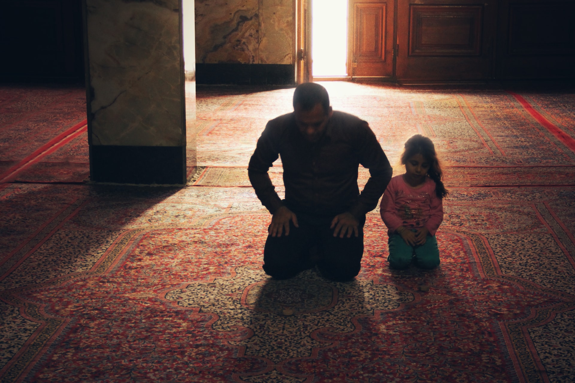 A father and his daughter. (Unsplash/Hasan Almasi)