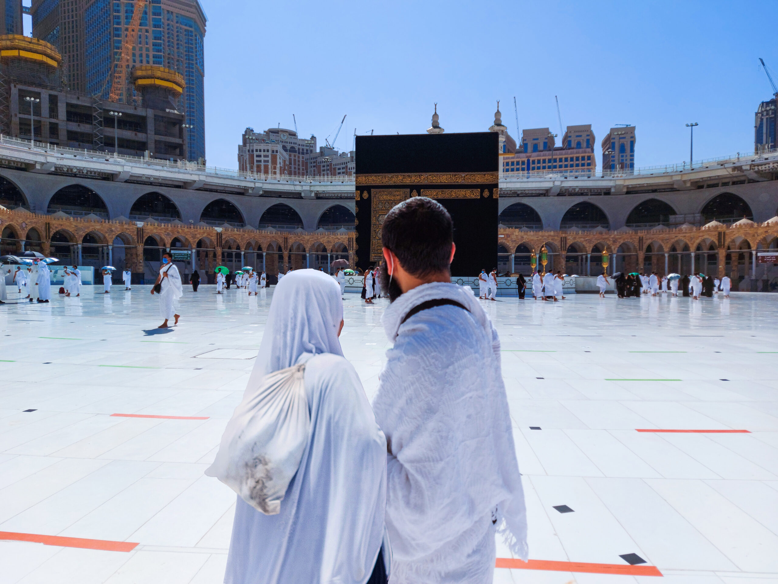 hajj, Umrah, Kaaba, muslim man and woman facing the Kaaba,