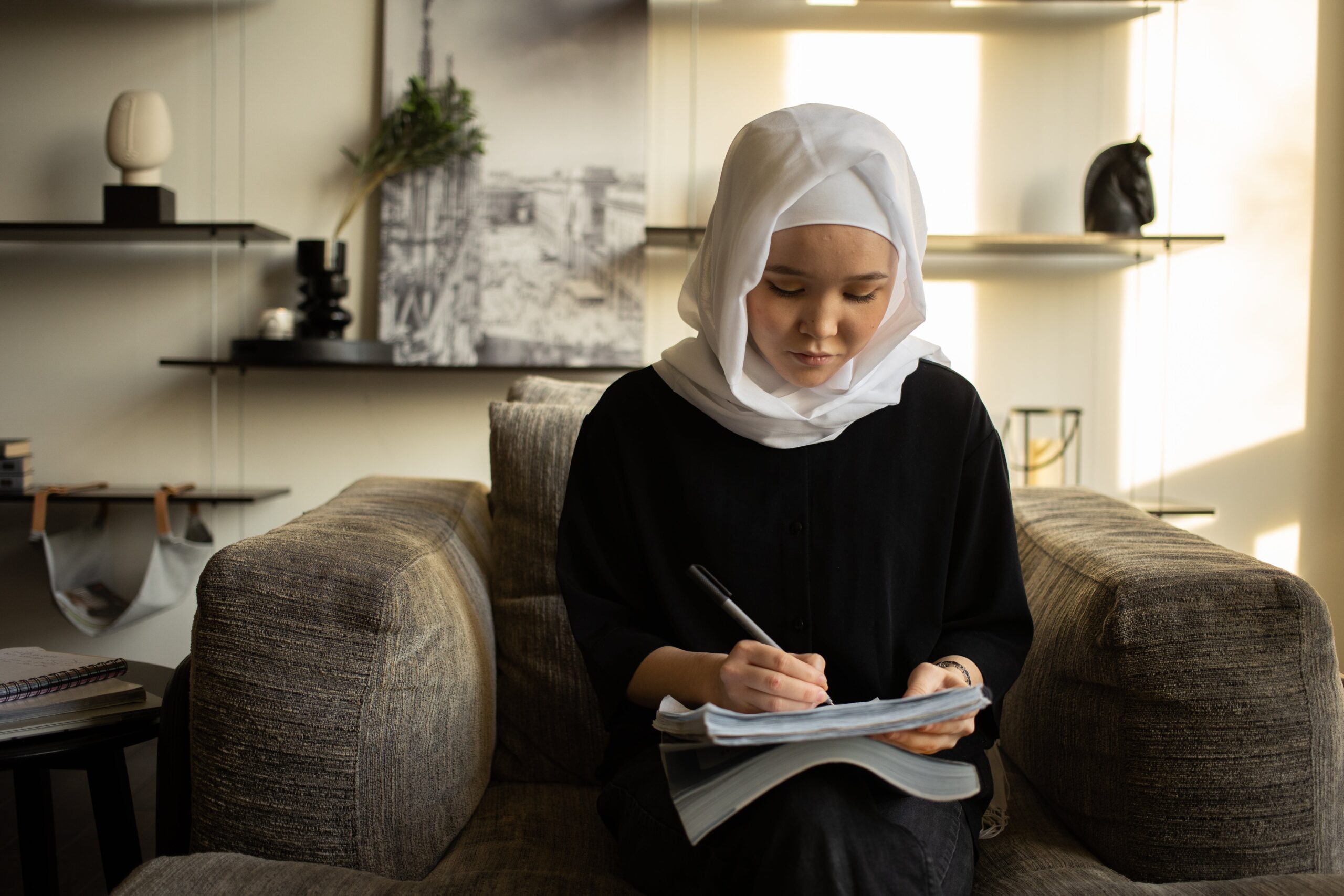 muslim woman writing in her journal