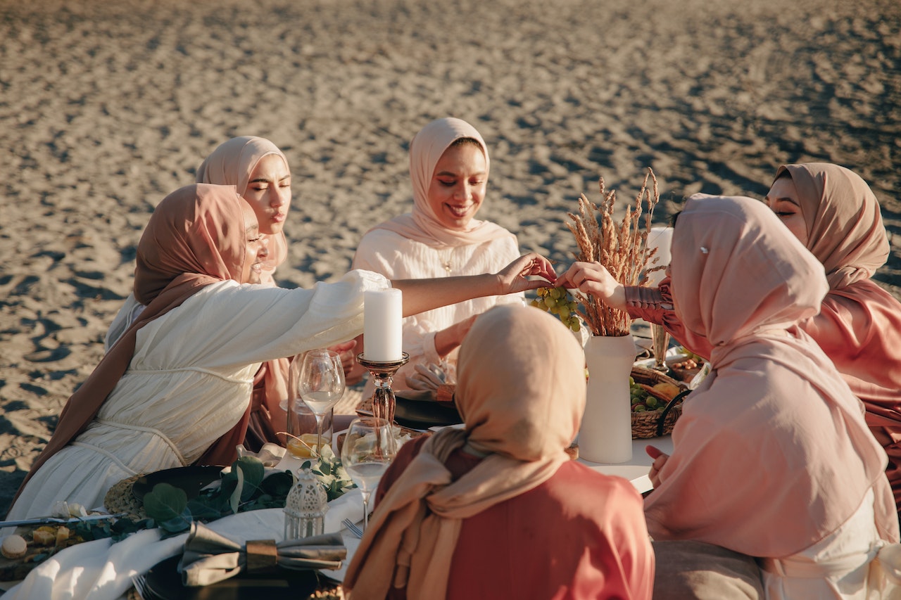 Hijabi muslim woman Strengthen Ties and Kinship through hugs and smile