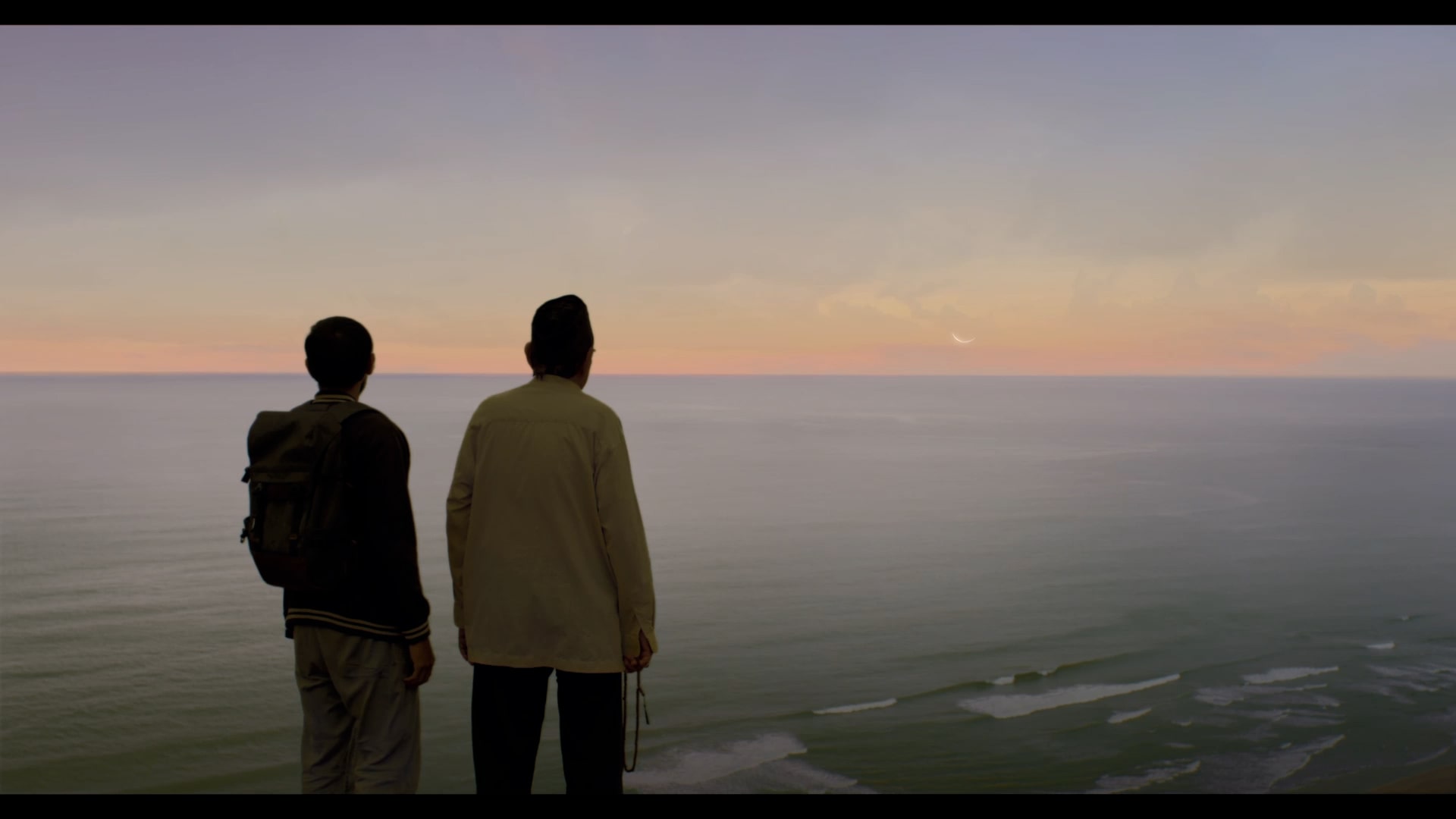 Father and son soaking in the sunset.