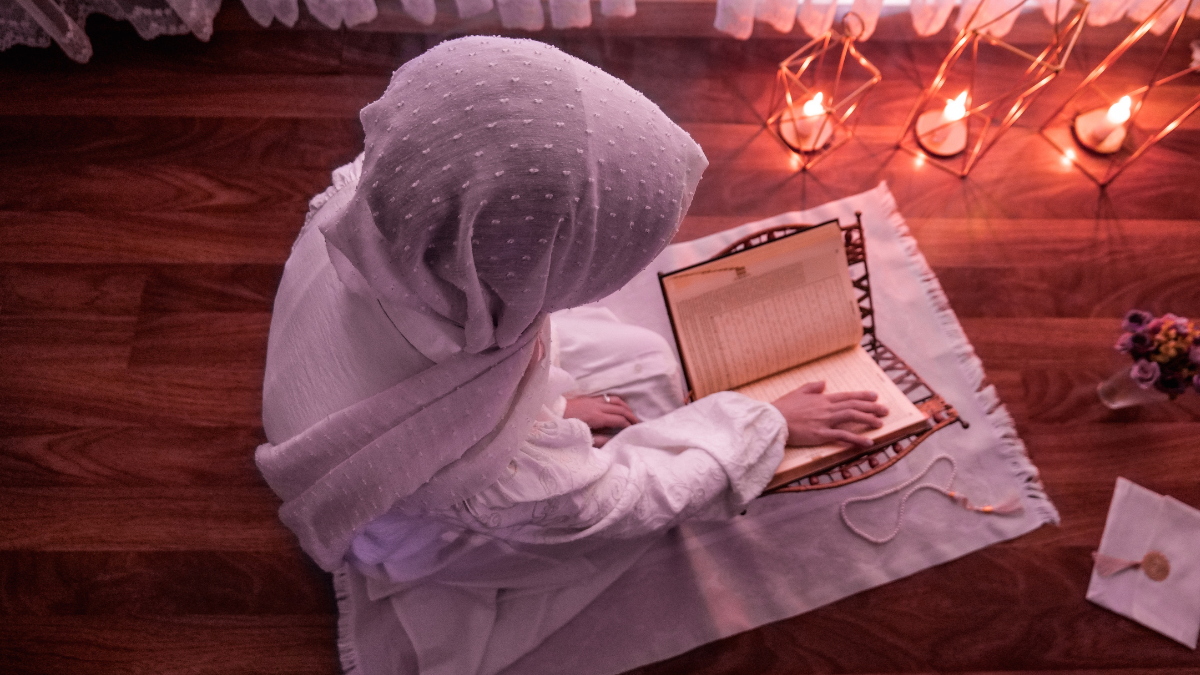 Muslimah reading the Al-Quran