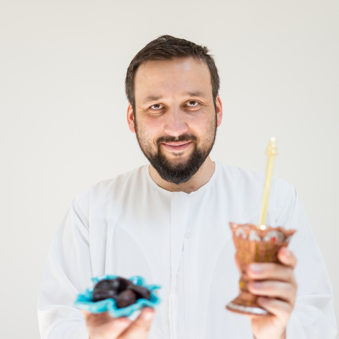 Muslim man offering iftar, dates and water, muslim man in white thob