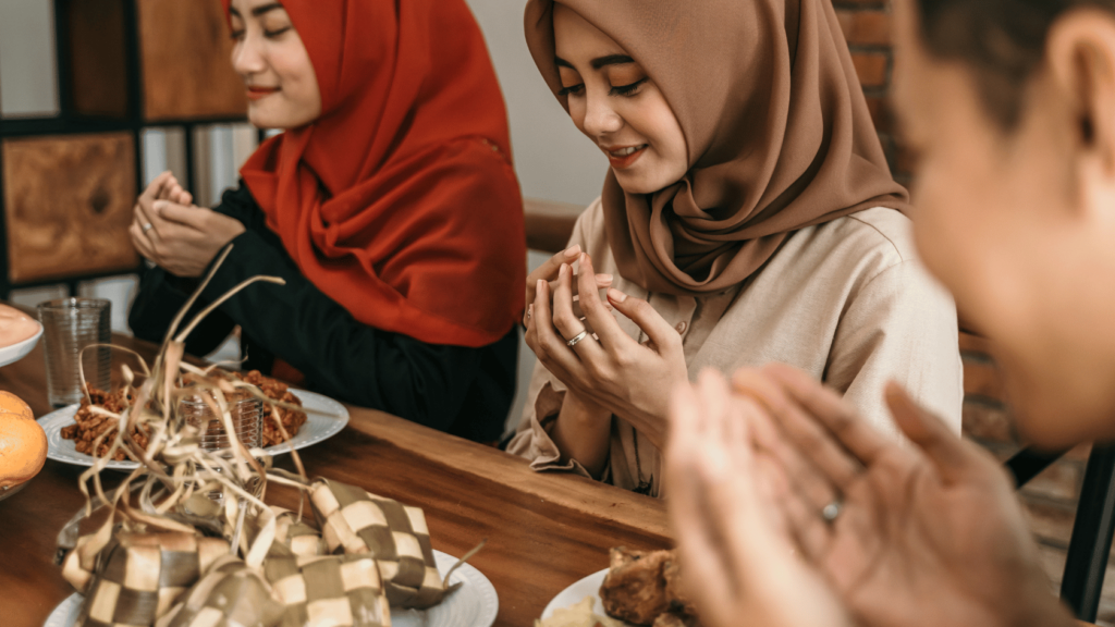 Muslims making dua before breaking their fast